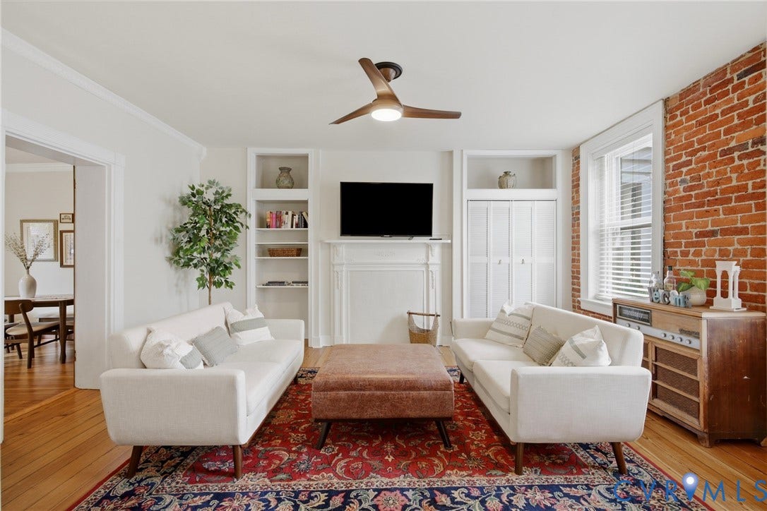 209 W Clay Street, Jackson Ward, Richmond, VA 23220 Hardwood floors, exposed brick accent wall, built-in shelving, natural light, ceiling fan
