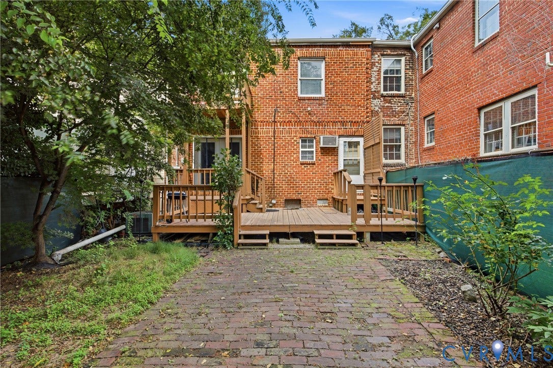 209 W Clay Street, Jackson Ward, Richmond, VA 23220 Brick exterior with a multi-level wood deck, wood railings, fenced