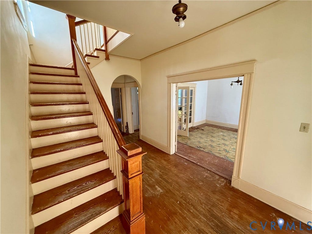 1313 Enfield Avenue, Richmond, VA 23224 Hardwood flooring, painted balusters, wood handrail, and arched doorways