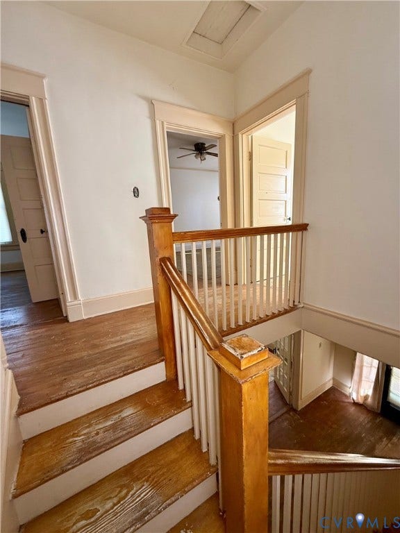 1313 Enfield Avenue, Richmond, VA 23224 Wooden staircase with white risers, wood-finish flooring, and white trim