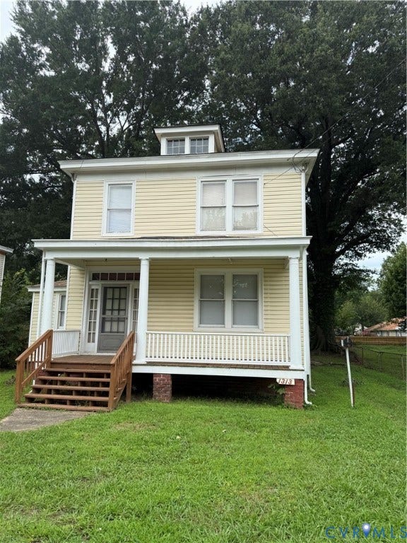 1313 Enfield Avenue, Richmond, VA 23224 Two-story residence with siding exterior, covered front porch, and dormer window
