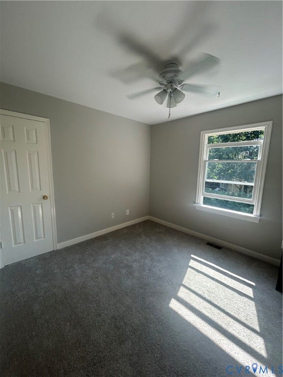 10641 Cliffmore Drive, Glen Allen, VA 23060 Neutral wall paint, ceiling fan with integrated lighting, window with white trim, and gray carpeting