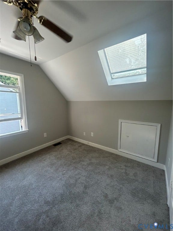 10641 Cliffmore Drive, Glen Allen, VA 23060 Sloped ceiling room featuring a skylight with blinds, wall-mounted access panel, and gray carpeting