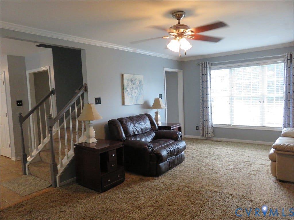 3107 McCabe Court, Chester, VA 23831 Expansive living area with a ceiling fan, crown molding, and large windows