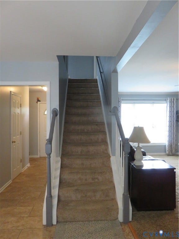 3107 McCabe Court, Chester, VA 23831 Carpeted staircase with painted handrail and white balusters