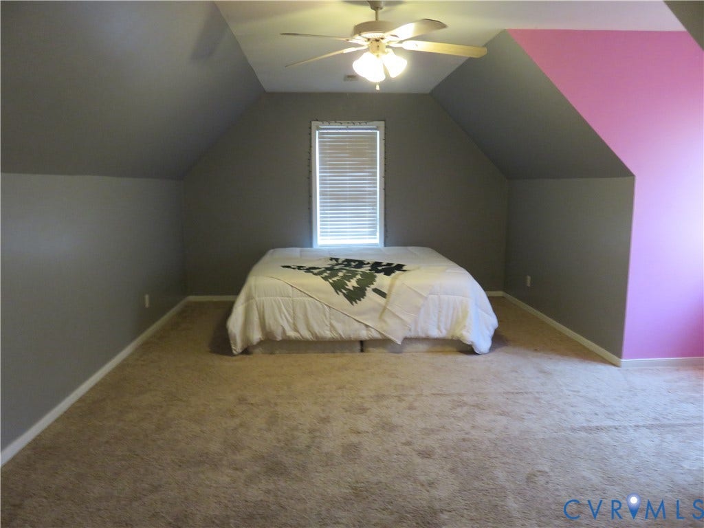 3107 McCabe Court, Chester, VA 23831 Carpeted flooring, sloped ceiling, window with blinds, ceiling fan, and painted walls
