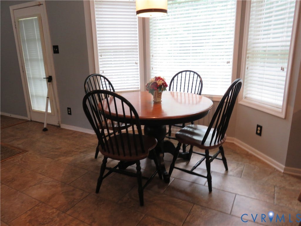 3107 McCabe Court, Chester, VA 23831 Bay window with white blinds, neutral wall paint, and tile flooring