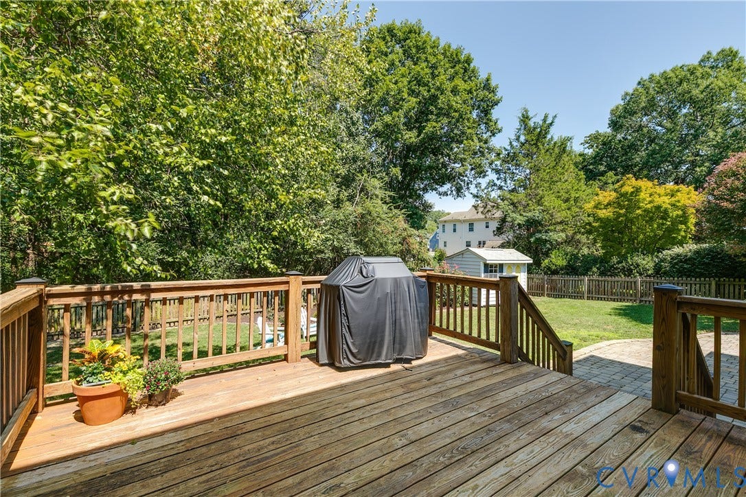 Rear Deck leads to stonepatio and large fenced back yard