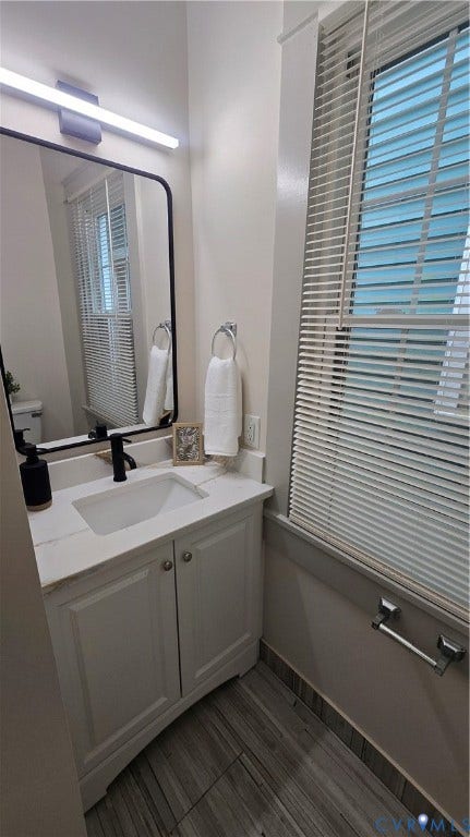 2317 5th Avenue, Richmond, VA 23222 White vanity with integrated sink and matte black faucet