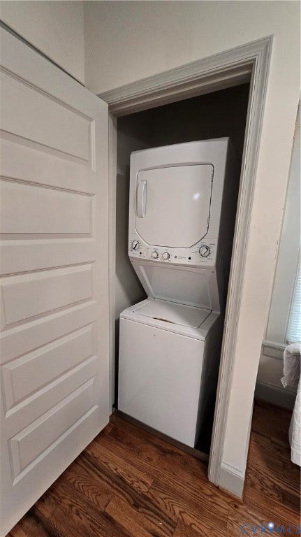 2317 5th Avenue, Richmond, VA 23222 Stackable white laundry appliances within a dedicated closet, featuring wood-finish flooring