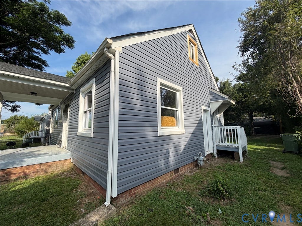 3911 Larchmont Lane, Richmond, VA 23224 Gray horizontal siding with white trim