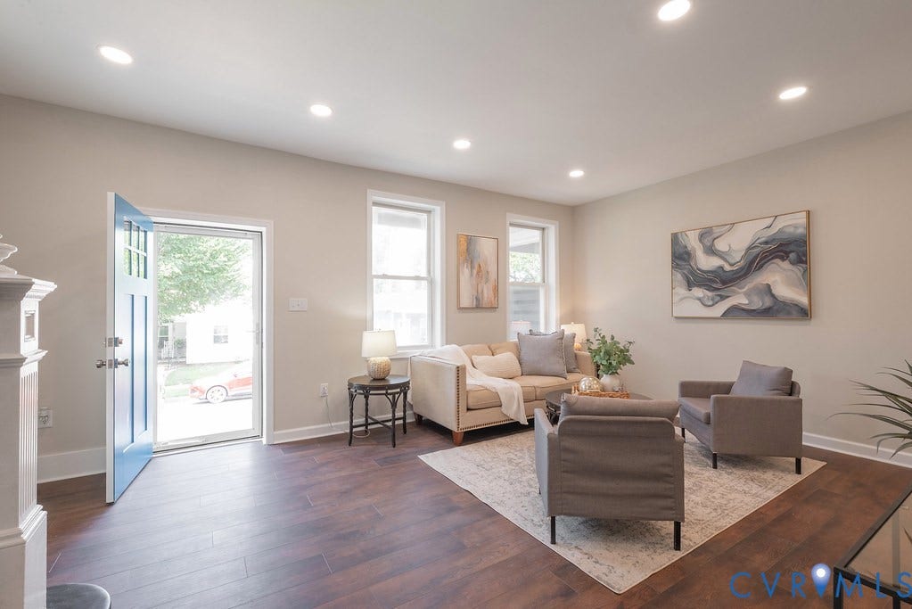 Recessed lighting illuminates wood-finish flooring
