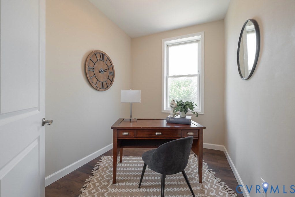 Hardwood-finish flooring, single window, and a paneled door