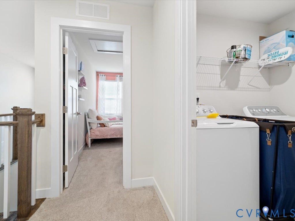 Dedicated laundry area with built-in wire shelving
