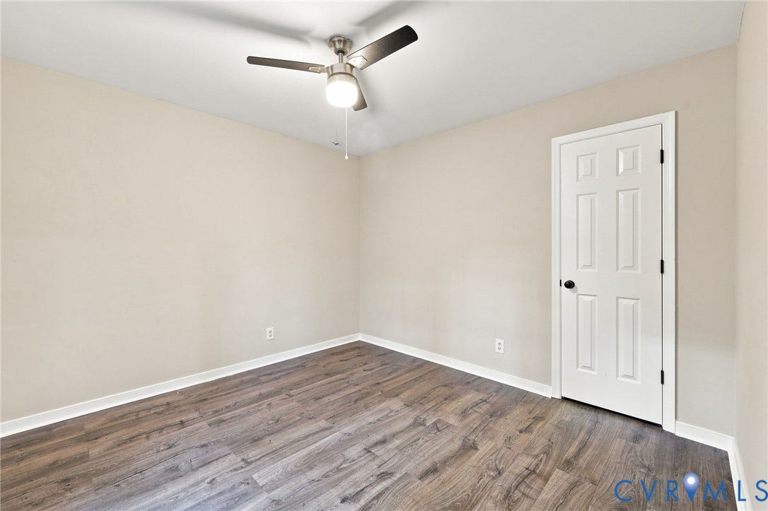 4106 Gloucestershire Street, North Chesterfield, VA 23236 Neutral wall colors, wood-finish flooring, ceiling fan with integrated lighting, and a paneled interior door