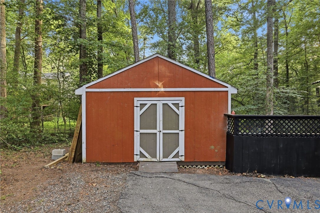 4106 Gloucestershire Street, North Chesterfield, VA 23236 Red-sided storage shed with white trim and double doors