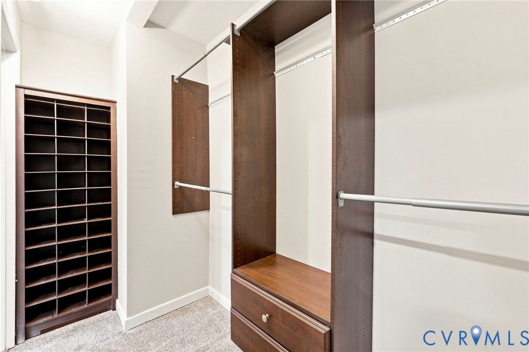 4106 Gloucestershire Street, North Chesterfield, VA 23236 Custom closet system featuring wood-finish shelving and built-in drawers