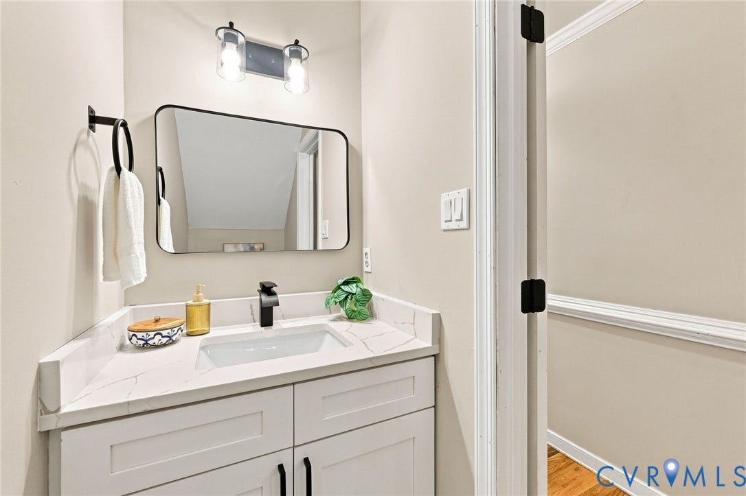 4106 Gloucestershire Street, North Chesterfield, VA 23236 White vanity with a rectangular undermount sink, quartz-finish countertop, and matte black faucet