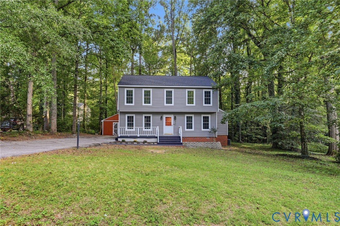 4106 Gloucestershire Street, North Chesterfield, VA 23236 Two-story residence featuring gray siding, a dark roof, and a front porch with white railings
