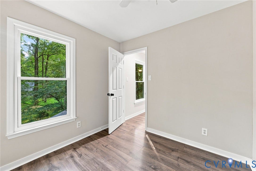 4106 Gloucestershire Street, North Chesterfield, VA 23236 Wood-finish flooring, white trim, and light gray wall paint