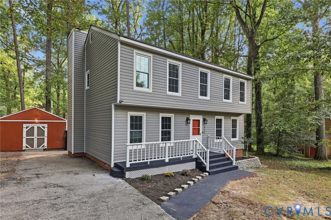 4106 Gloucestershire Street, North Chesterfield, VA 23236 Two-story residence with gray siding, white trim, and a prominent red entry door