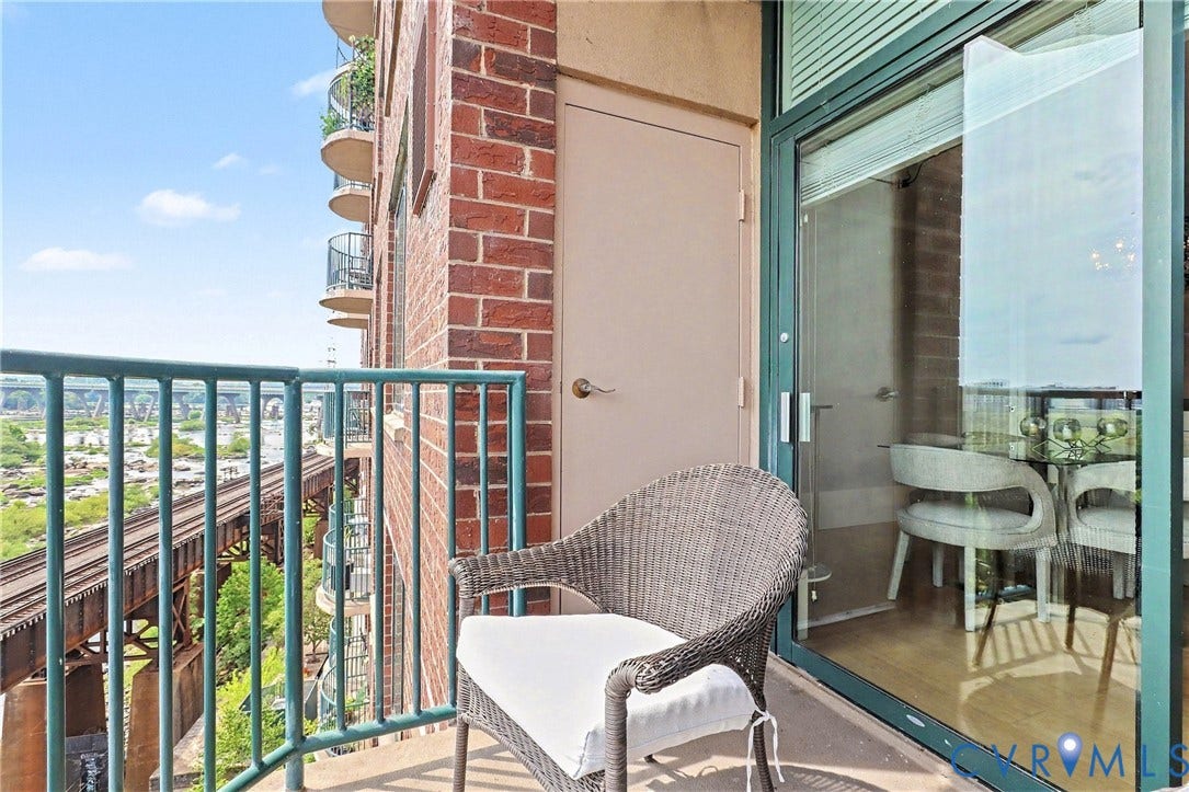 1101 Haxall Point, #U512 U510, Richmond, VA 23219 Private balcony featuring a metal railing, durable flooring, and a sliding glass door