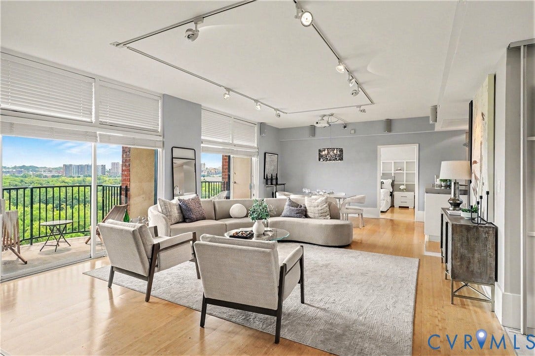 1101 Haxall Point, #U512 U510, Richmond, VA 23219 Hardwood flooring, and track lighting complement the open living area with sliding glass doors leading to 2 private balconies.