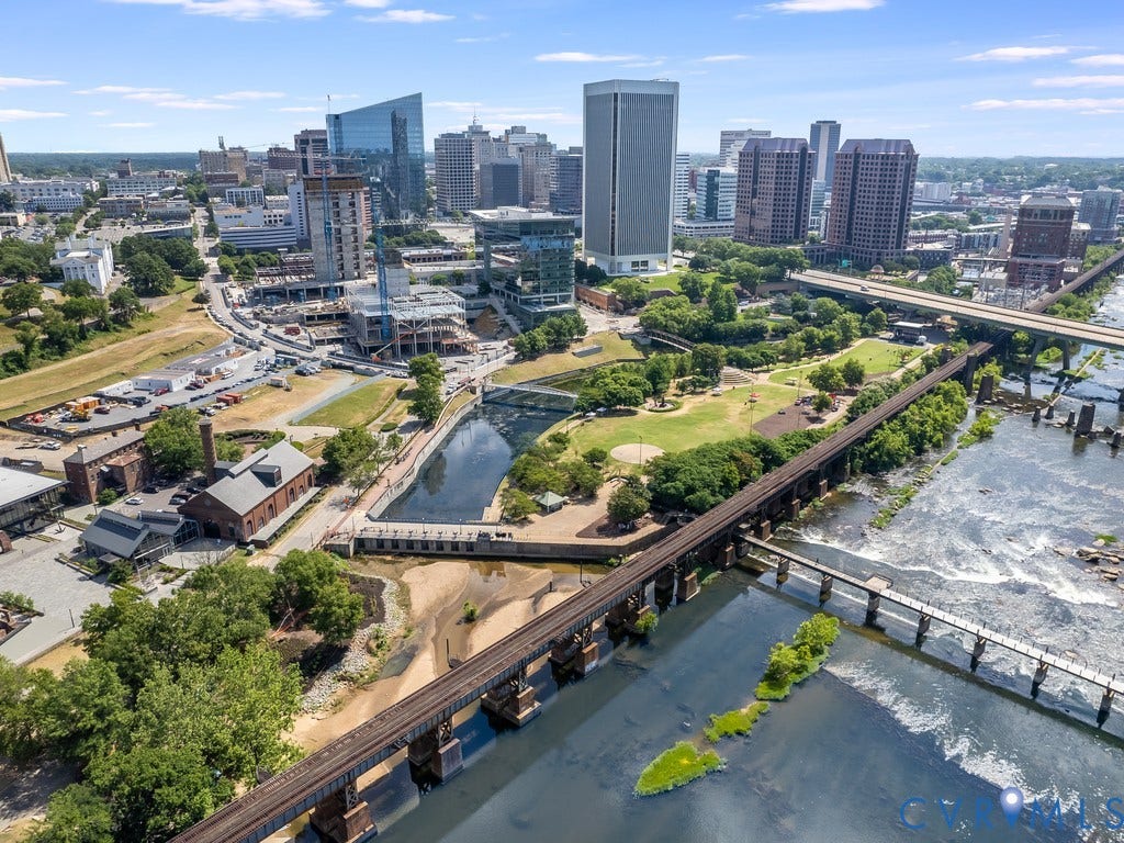 1101 Haxall Point, #U512 U510, Richmond, VA 23219 Urban cityscape featuring multiple high-rise buildings, extensive river frontage, and multiple bridge structures