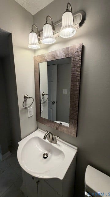 Vanity with an integrated white sink, brushed nickel faucet, and a framed mirror