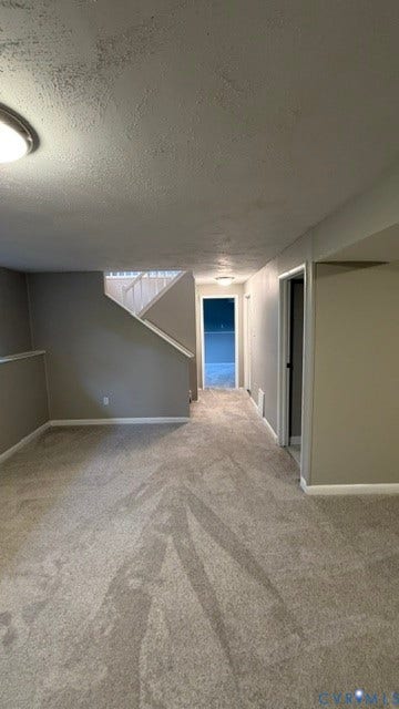 Finished space featuring wall-to-wall carpeting, neutral wall tones, and recessed lighting