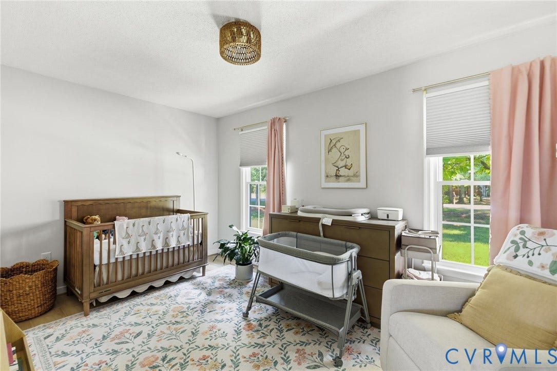 10744 Brookley Road, Glen Allen, VA 23060 Bright room with dual windows, neutral wall tones, and a woven flush-mount ceiling fixture