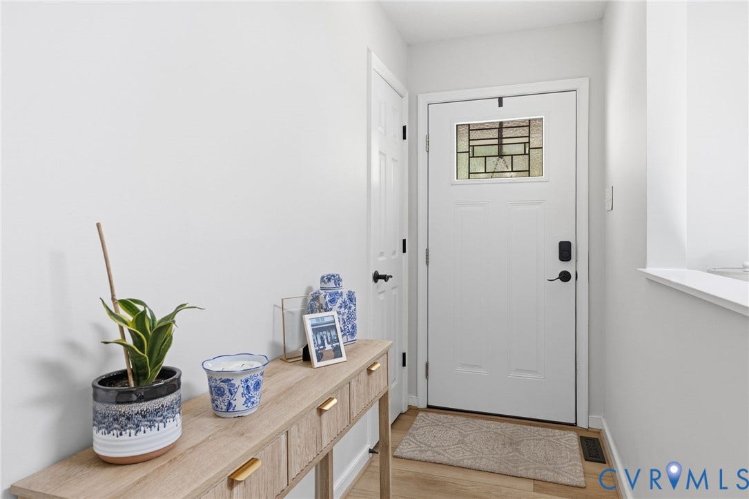 10744 Brookley Road, Glen Allen, VA 23060 Entryway featuring a white paneled door with decorative glass, light wood-finish flooring, and a built-in shelf