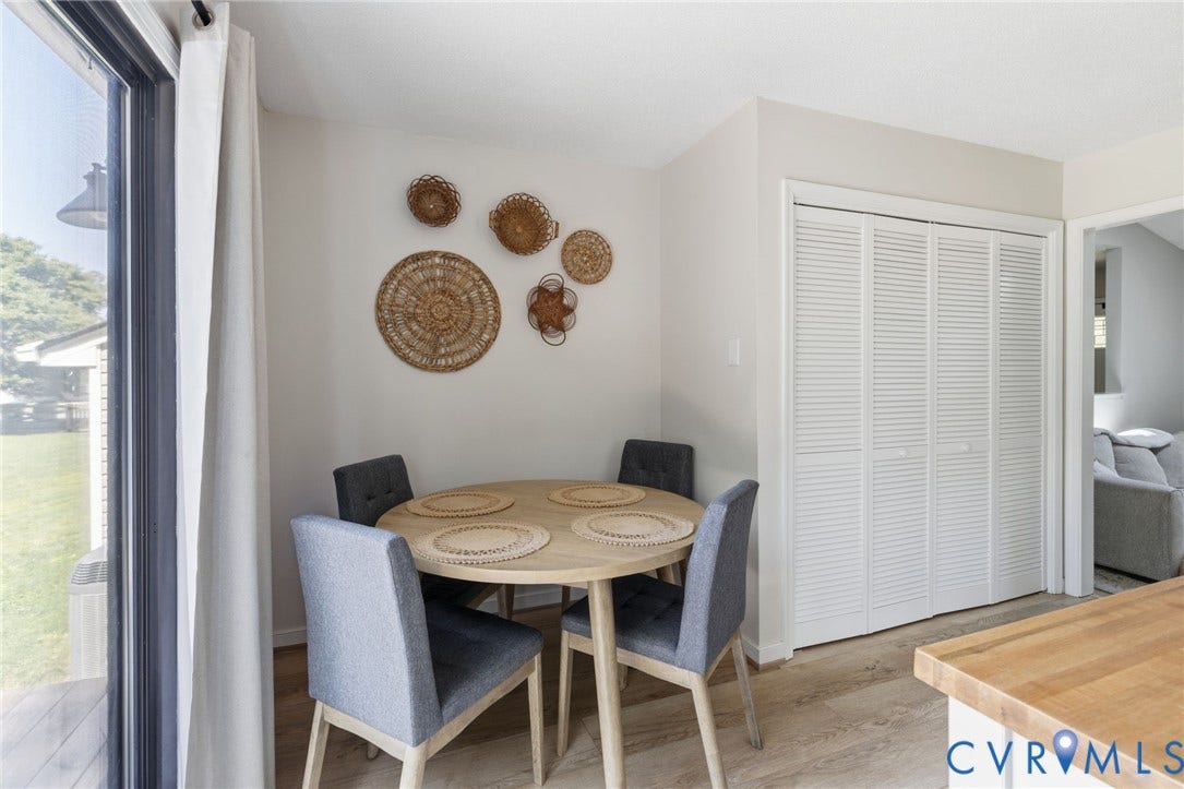 10744 Brookley Road, Glen Allen, VA 23060 Wood-finish flooring, white louvered bifold doors, and a sliding glass door