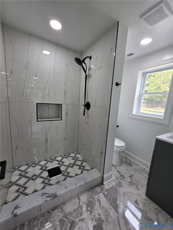16109 Meridian Avenue, Chester, VA 23831 Walk-in shower with patterned floor tile and large format wall tile, black shower fixtures, recessed lighting, and a built-in shower niche