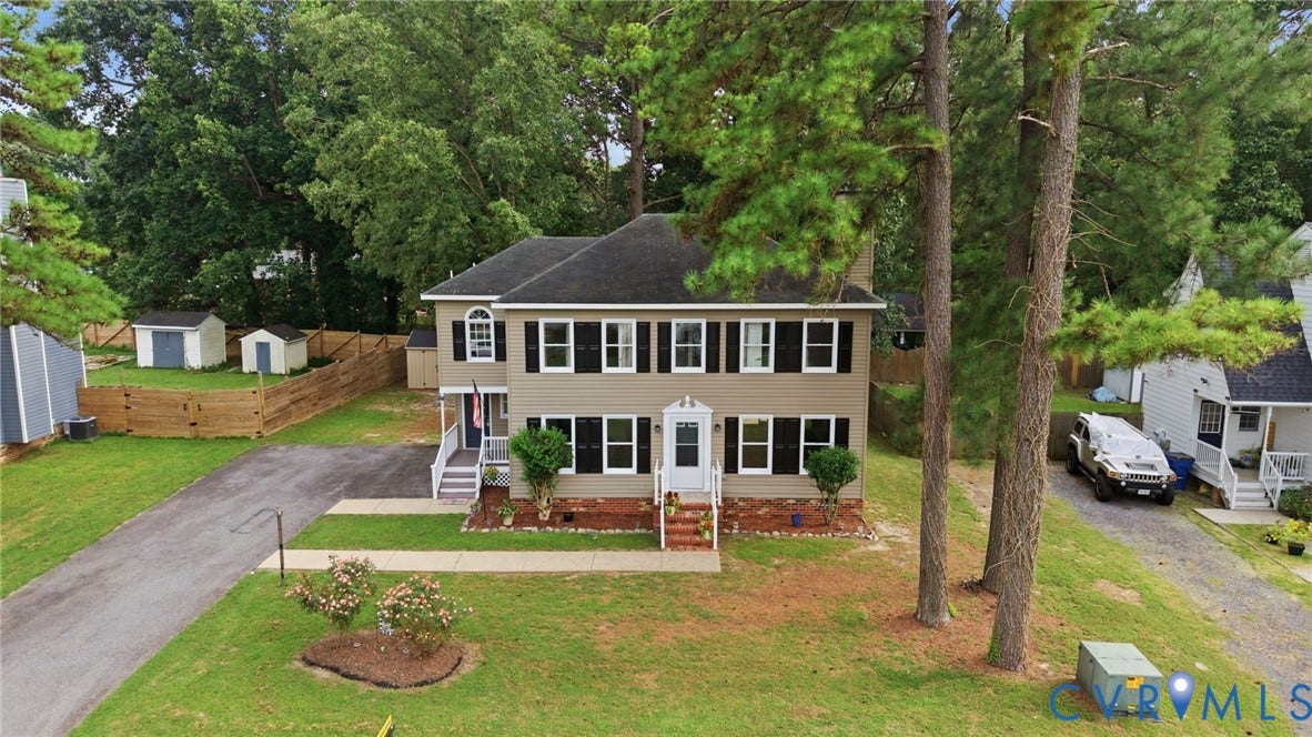 2807 Executive Drive, John Tyler Woods, Chesterfield, VA 23831 Two-story exterior with a covered entry, white porch railings, and black window shutters