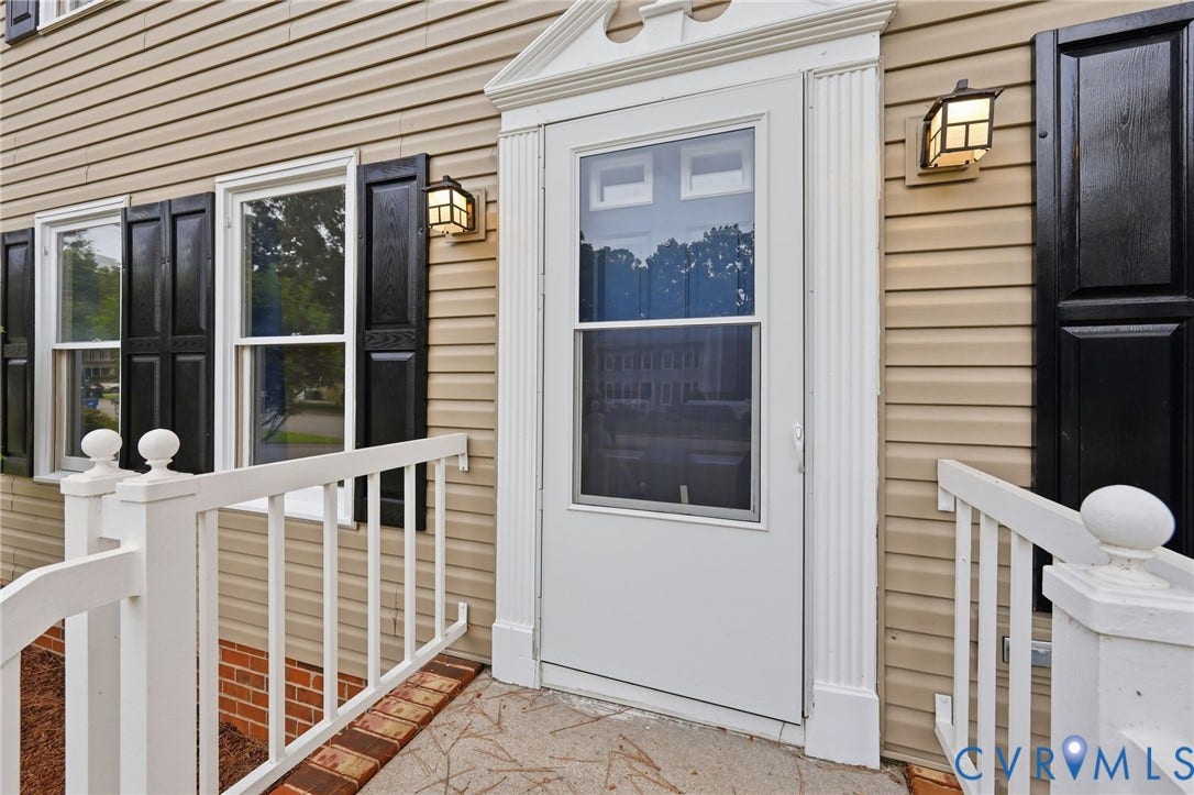 2807 Executive Drive, John Tyler Woods, Chesterfield, VA 23831 Welcoming entry featuring a white-trimmed glass and wood door with sidelights, flanked by white composite railings