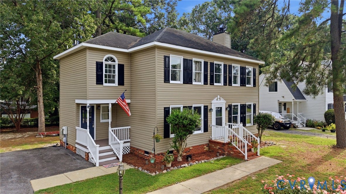 2807 Executive Drive, John Tyler Woods, Chesterfield, VA 23831 Two-story residence featuring light-toned siding and dark shutters