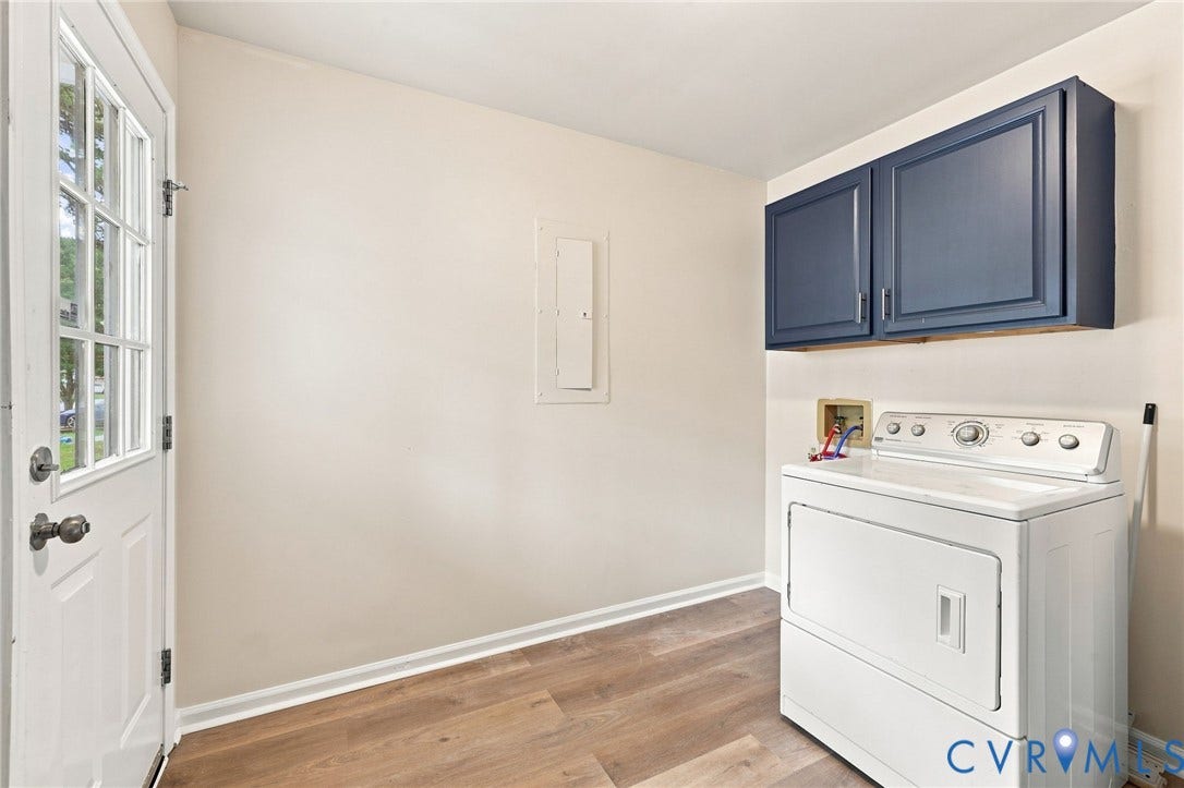 2807 Executive Drive, John Tyler Woods, Chesterfield, VA 23831 Wood-finish flooring, white walls, and a white paneled door with windowpanes