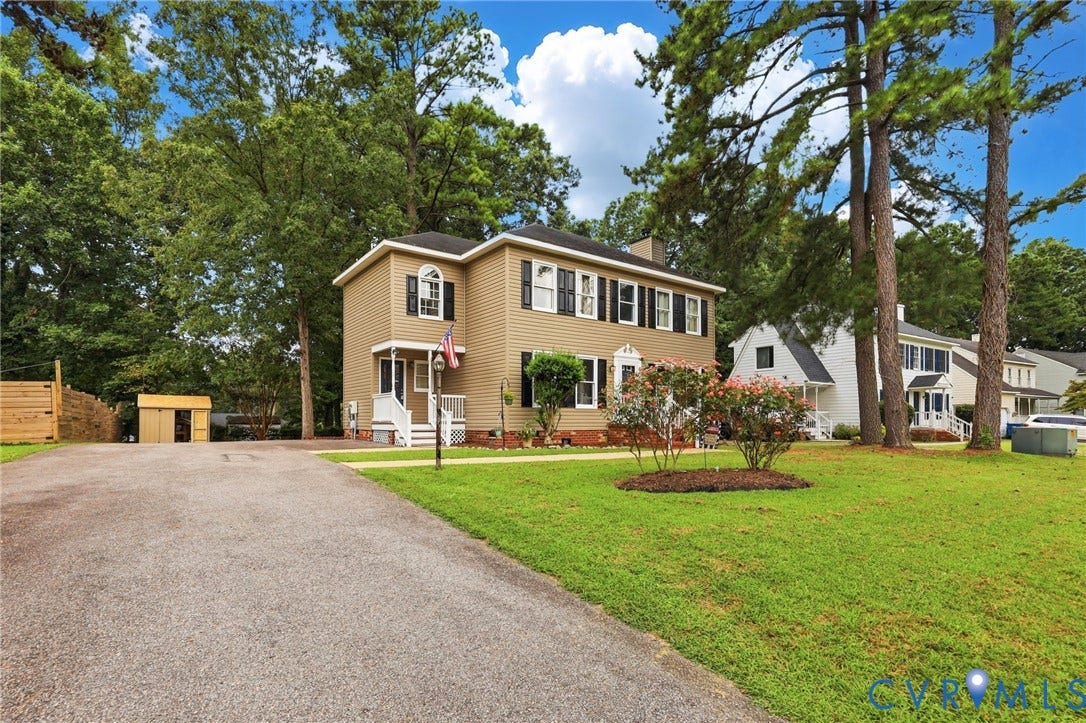 2807 Executive Drive, John Tyler Woods, Chesterfield, VA 23831 Two-story property with tan siding, black shutters, white trim, and a white front porch