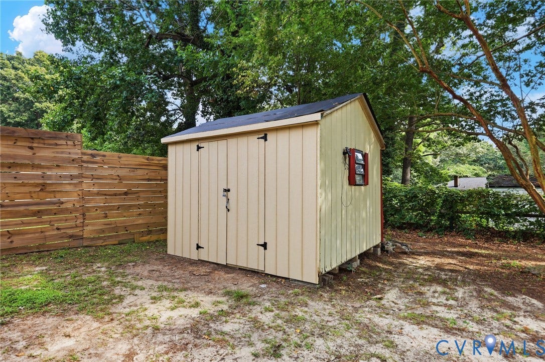 2807 Executive Drive, John Tyler Woods, Chesterfield, VA 23831 Detached storage shed with a gabled roof and board-and-batten siding