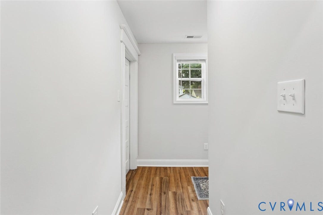 Wood-finish flooring with crisp white trim