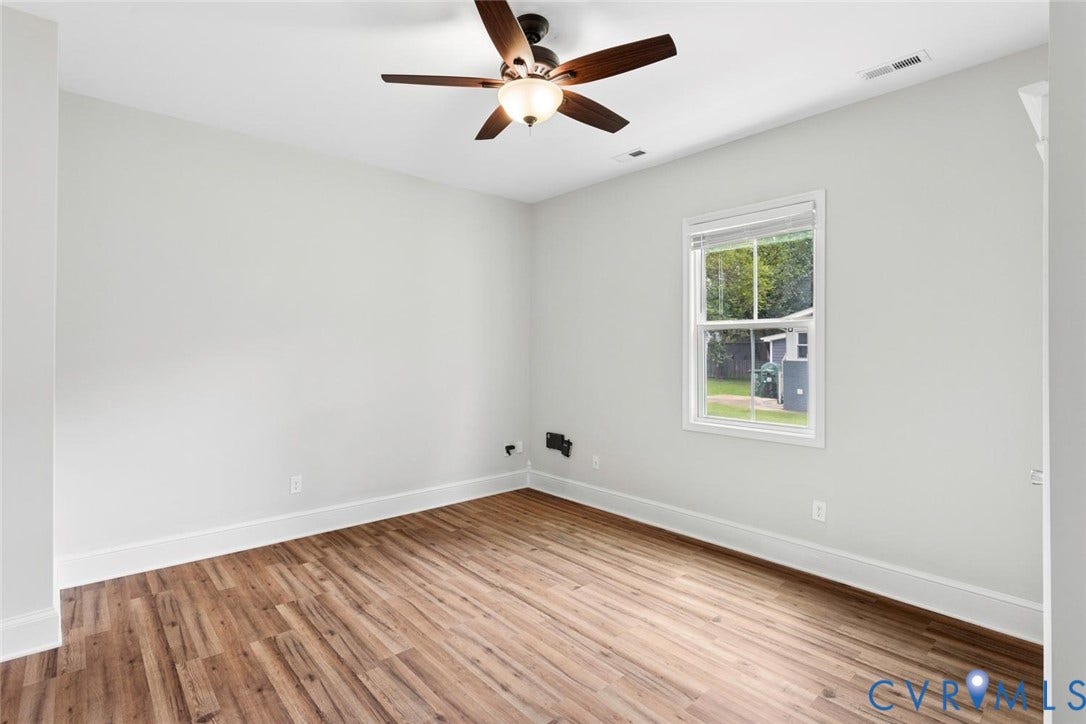 Recessed lighting, wood-finish flooring, ceiling fan with light fixture, double-hung window, and white trim