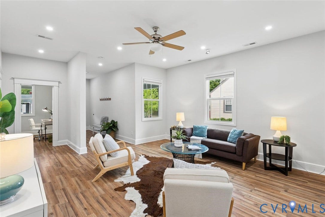 Wood-finish flooring throughout, recessed lighting, and a ceiling fan with light kit