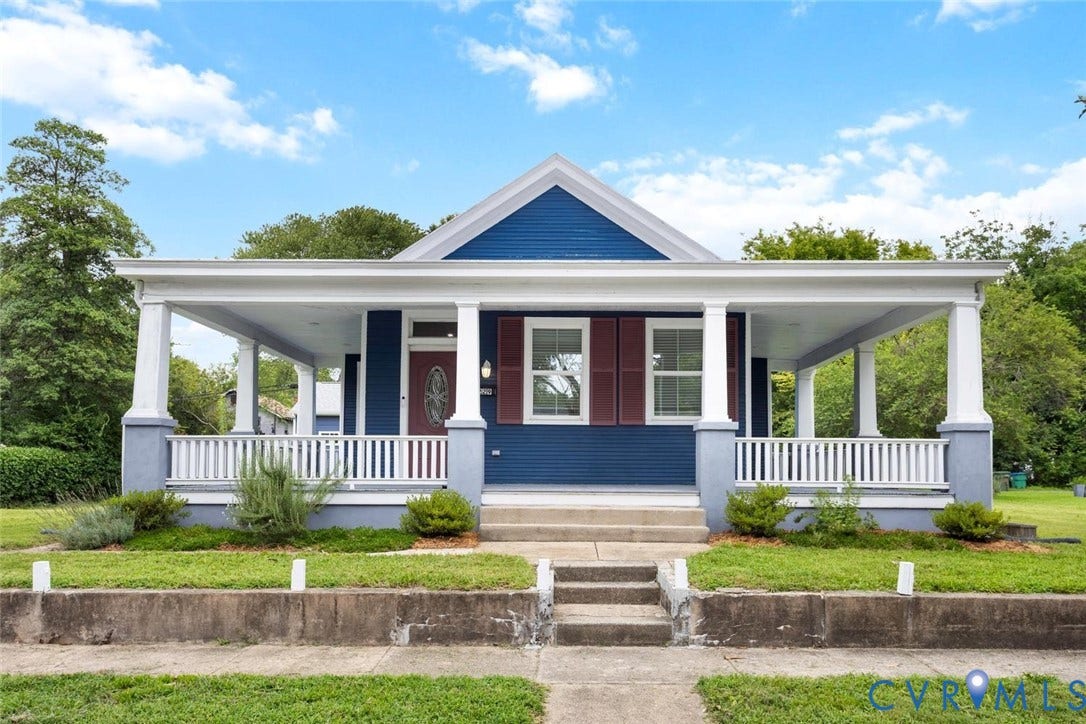Blue siding exterior with white trim
