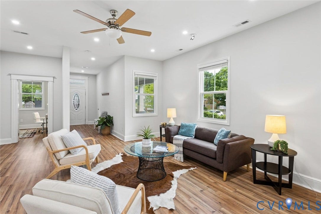 Wood-finish flooring throughout, recessed lighting, and a ceiling fan