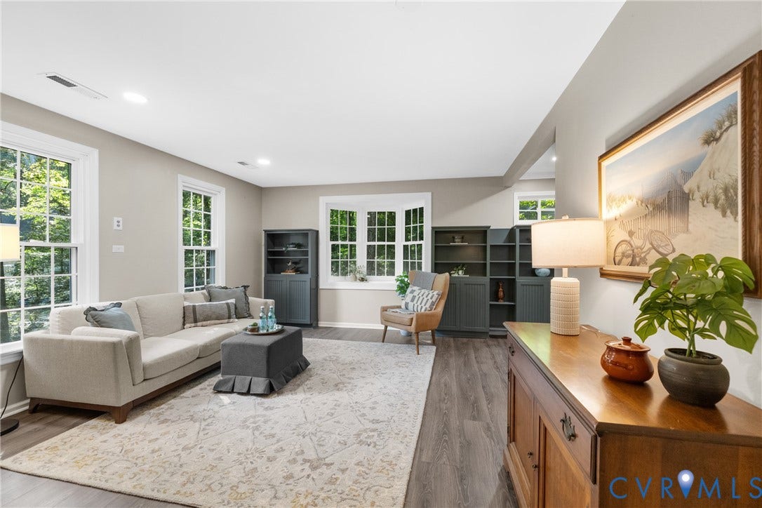 4906 Court Ridge Terrace, Brandermill, Midlothian, VA 23112 Spacious living area featuring abundant natural light, recessed lighting, built-in shelving, and wood-finish flooring