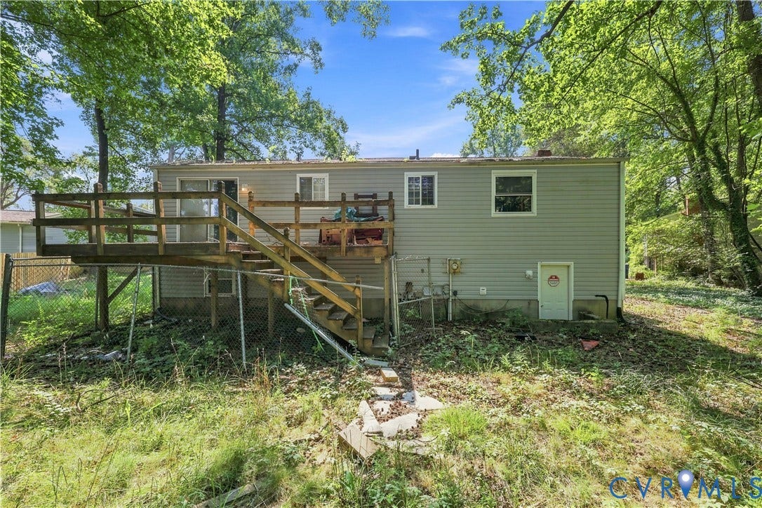 6500 Watchspring Court, Watch Run, Richmond, VA 23234 Rear exterior featuring a wood deck with stairs, light gray siding, and an outdoor access door