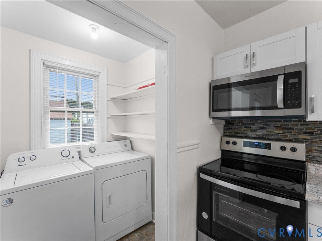 Dedicated laundry area with window and shelving