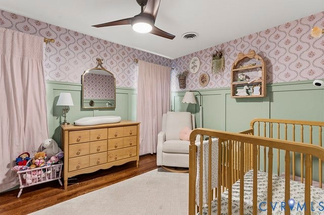 2016 Wrens Nest Road, Settlers Landing, Richmond, VA 23235 Ceiling fan with integrated lighting, wood-finish flooring, two-tone wall treatment with wainscoting, decorative wallpaper, and built-in shelving
