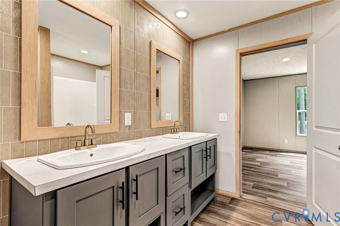 15263 Cross County Road, Mineral, VA 23117 Dual vanity with integrated sinks and gray cabinetry, complemented by a tiled backsplash